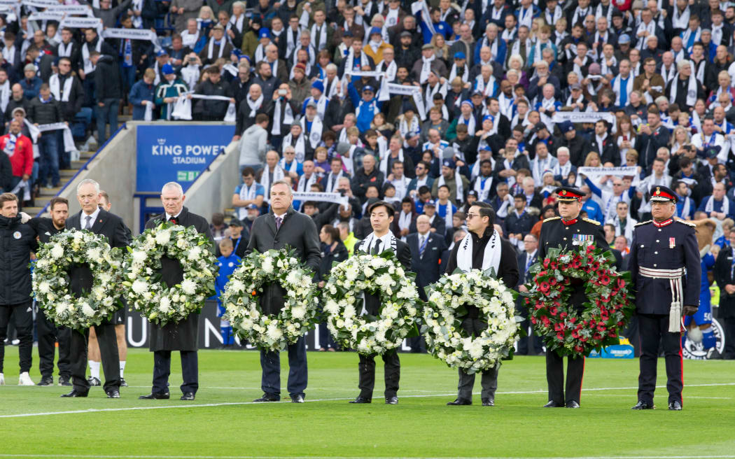 Wreaths are held by the family in honour of the late Leicester City Owner Khun Vichai Srivaddhanaprabha and other people that lost their lives in a helicopter crash.