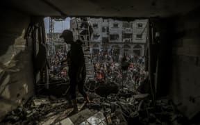 12/07/2023 Gaza, Palestine. Palestinian residents are actively involved in search and rescue efforts following the Israeli airstrikes on December 7, 2023, in Khan Yunis, Gaza. The increased military activities by Israel in southern Gaza have prompted these local rescue operations. During their efforts, they uncovered six injured individuals and discovered the lifeless bodies of fifteen victims in the aftermath of the airstrikes. (Photo by Mohammed Zaanoun / Middle East images / Middle East Images via AFP)