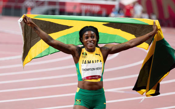 Elaine Thompson Herah of Jamaica celebrates after winning Olympic gold