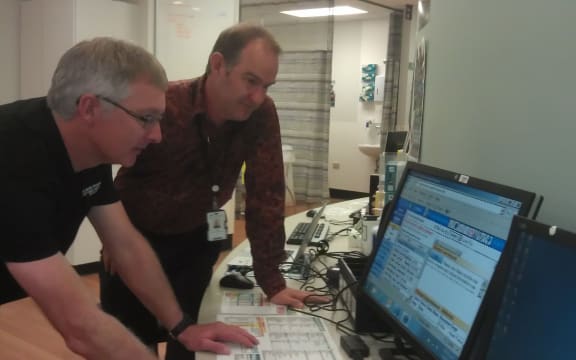 Wellington Hospital Emergency Department clinical leader Andre Cromhout and CCDHB's Peter Hicks study GP records online.