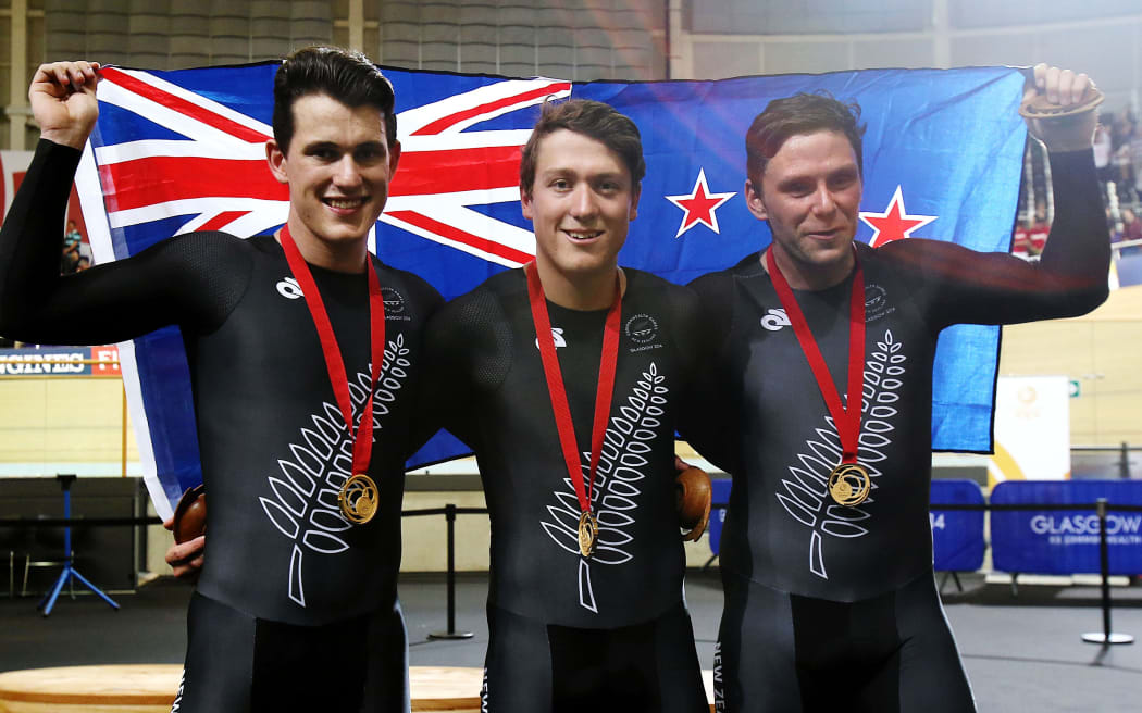Sam Webster, Ethan Mitchell and Eddie Dawkins celebrate after winning gold in the Men's Team Sprint.