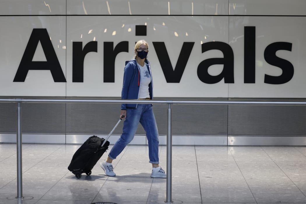 Travellers arrive at Heathrow's Terminal 5 in west London on 2 August, 2021 as quarantine restrictions ease.