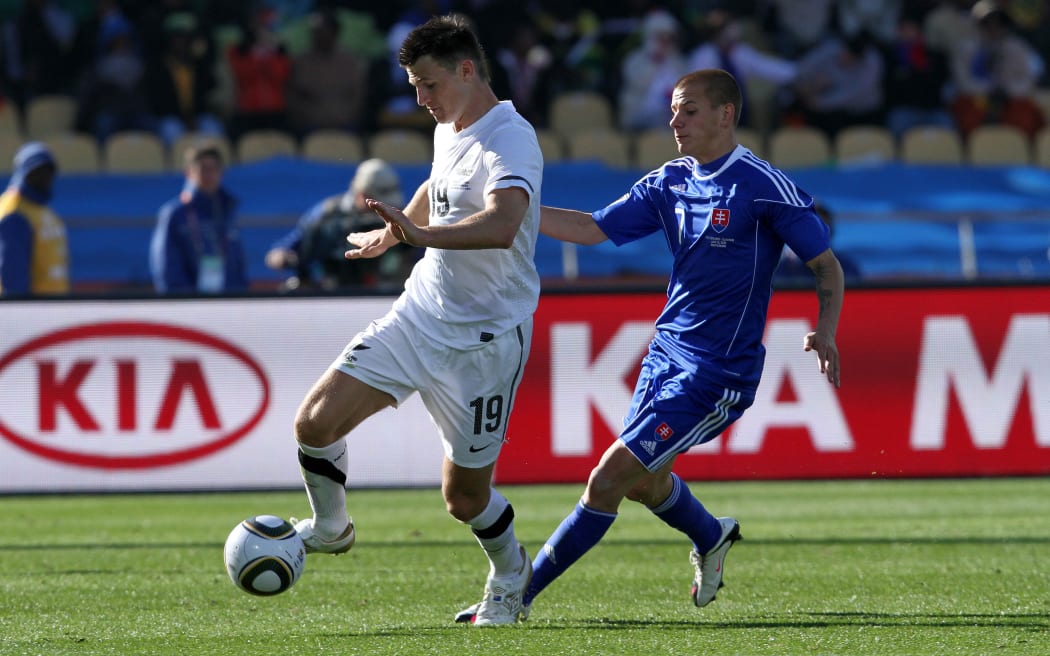 Tommy Smith of New Zealand  and Vladimir Weiss of Slovakia  during the the FIFA World Cup 2010 match