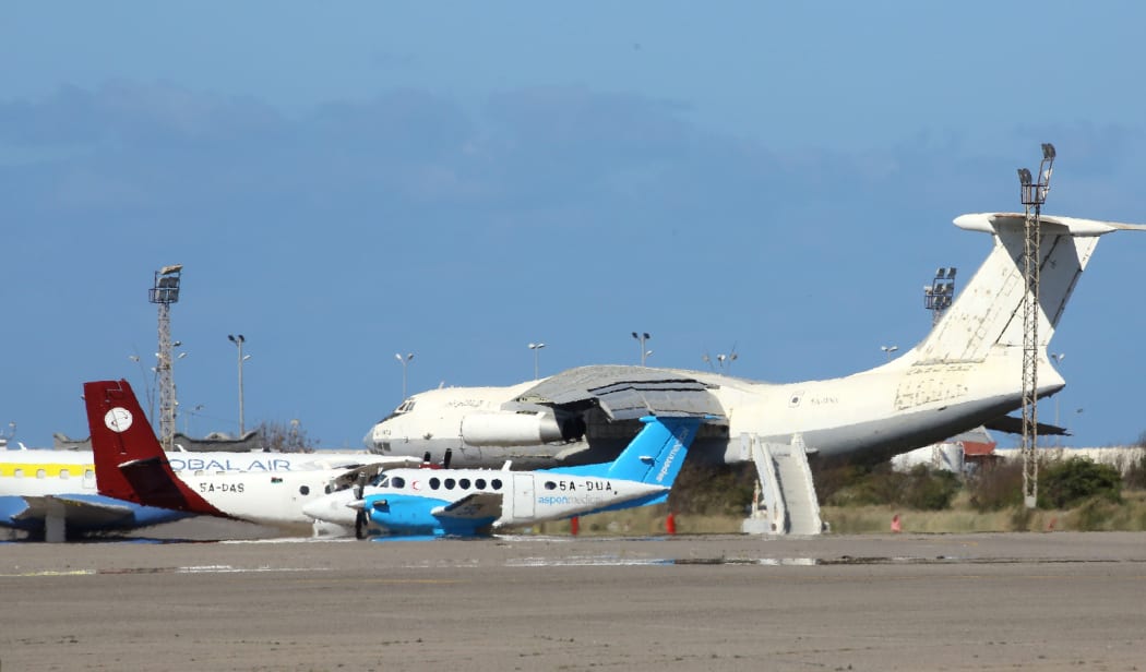Planes at Mitiga International Airport in Libya's capital Tripoli on April 8, 2019 after it was closed following an air strike.