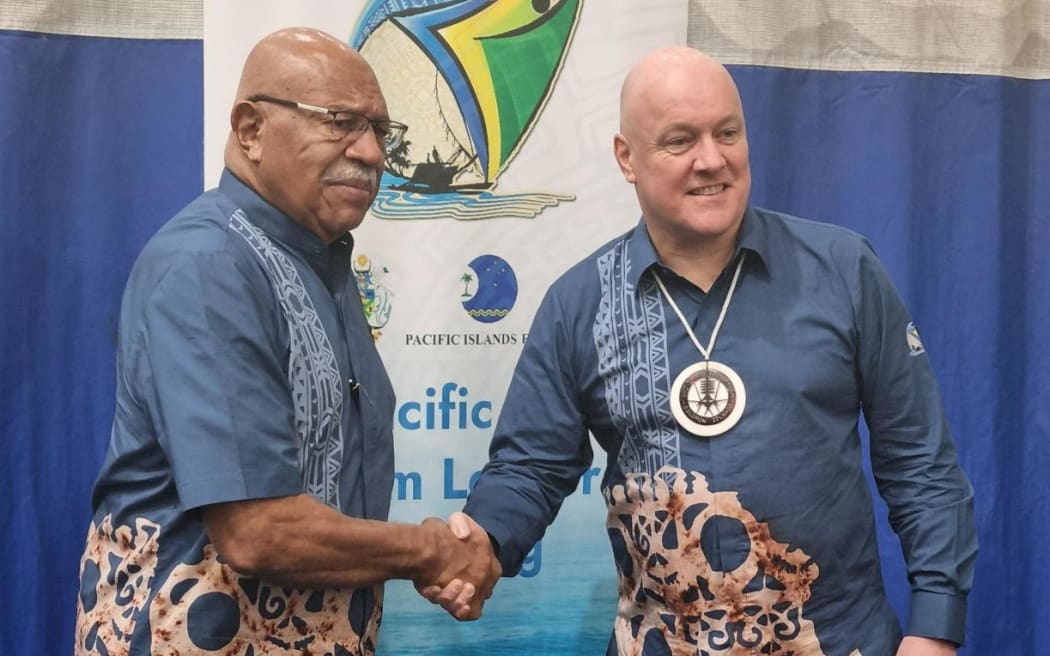 Fijian PM Sitiveni Rabuka greets NZ PM Christopher Luxon at the Pacific Islands Forum in Honiara.