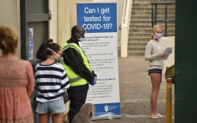People line up at a Covid-19 coronavirus testing station at Bondi Beach in Sydney