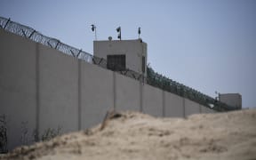 This photo taken on May 31, 2019 shows the outer wall of a complex which includes what is believed to be a re-education camp where mostly Muslim ethnic minorities are detained, on the outskirts of Hotan, in China's northwestern Xinjiang region.