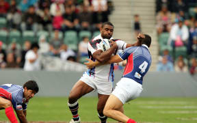Wes Naiqama fends off the French defence during the 2008 World Cup.
