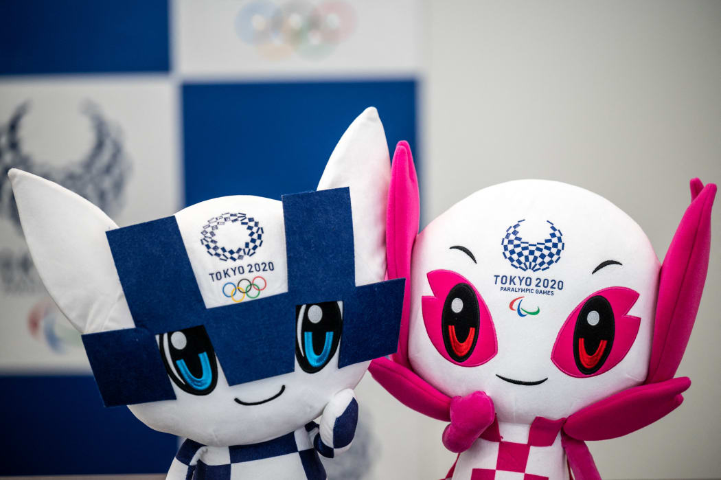 This picture shows Miraitowa (L) and Someity (R), mascots for the Tokyo 2020 Olympic and Paralympic Games, at the office of the Tokyo 2020 Organising Committee of the Olympic and Paralympic Games in Tokyo on April 30, 2021.