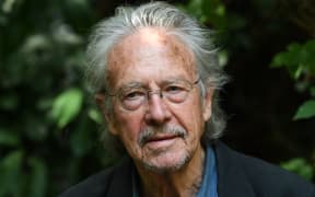 Austrian writer Peter Handke poses in Chaville, in the Paris surburbs, on October 10, 2019 after he was awarded with the 2019 Nobel Literature Prize. -