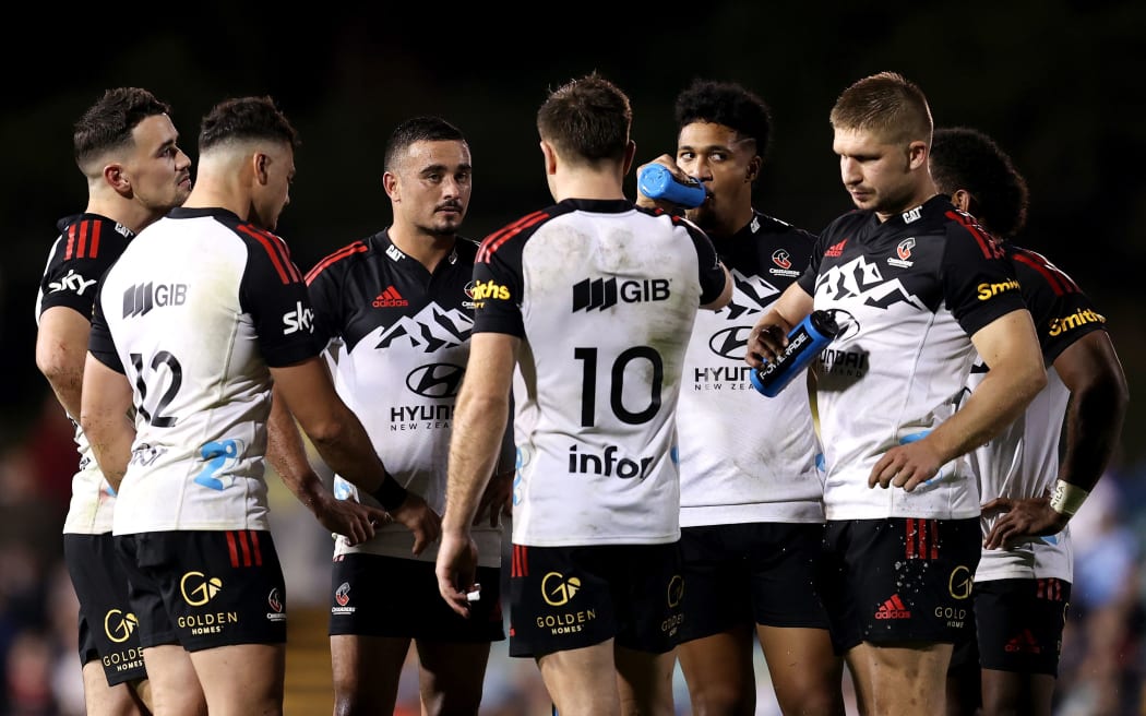 Crusaders players chat during their Super Rugby Pacific Round 11 match against the NSW Waratahs.