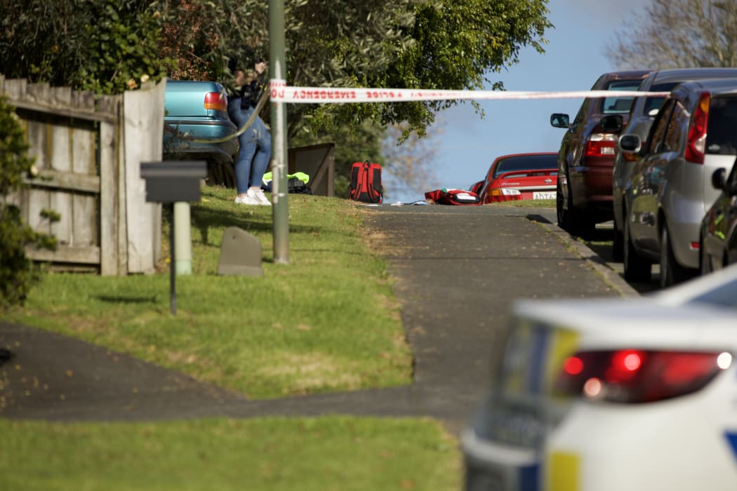 A police cordon surrounds debris at the scene of a police shooting in Massey, Wellington, 19 June 2020.