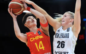You Tang of China controls the ball against Tayla Dalton of New Zealand during the FIBA Women's Asia Cup, Sydney 2023.