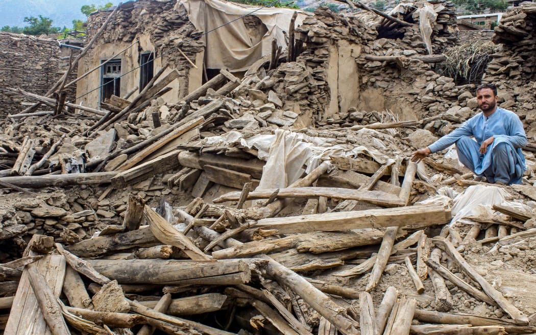 An Afghan man sits amid the remains of a damaged house, in the aftermath of an earthquake at the Dara-i-Nur district of Nangarhar province on 3 September, 2025. Hope was quickly fading of finding survivors in the rubble of homes devastated by the weekend's powerful 6.0-magnitude quake in eastern Afghanistan, as emergency services struggled to reach remote villages on September 3.