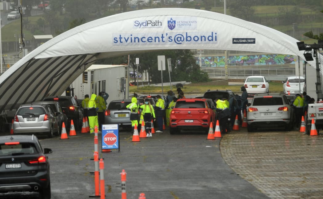 Medical officers conduct a mass Covid-19 testing at a parking lot on Bondi Beach in Sydney on May 6, 2021,