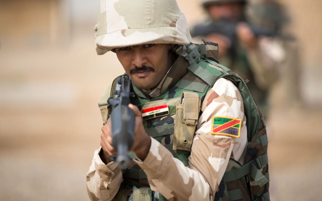 Iraqi troops training in urban clearances and tactics.