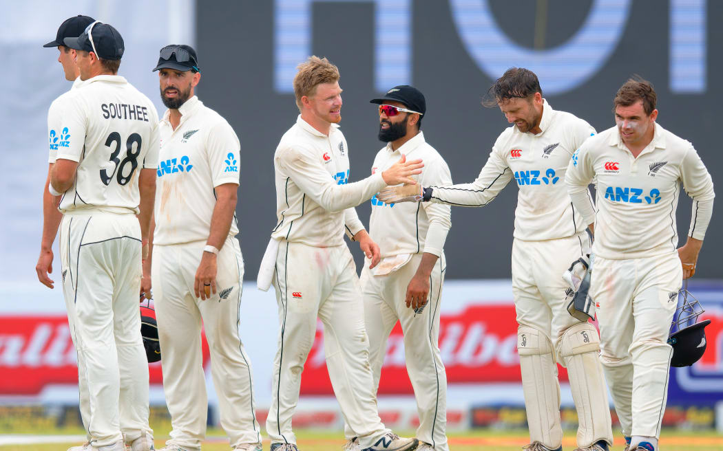 Black Caps bowler Glenn Phillips and wicketkeeper Tom Blundell celebrate a rare moment of success on day two of the second cricket test against Sri Lanka in Galle.