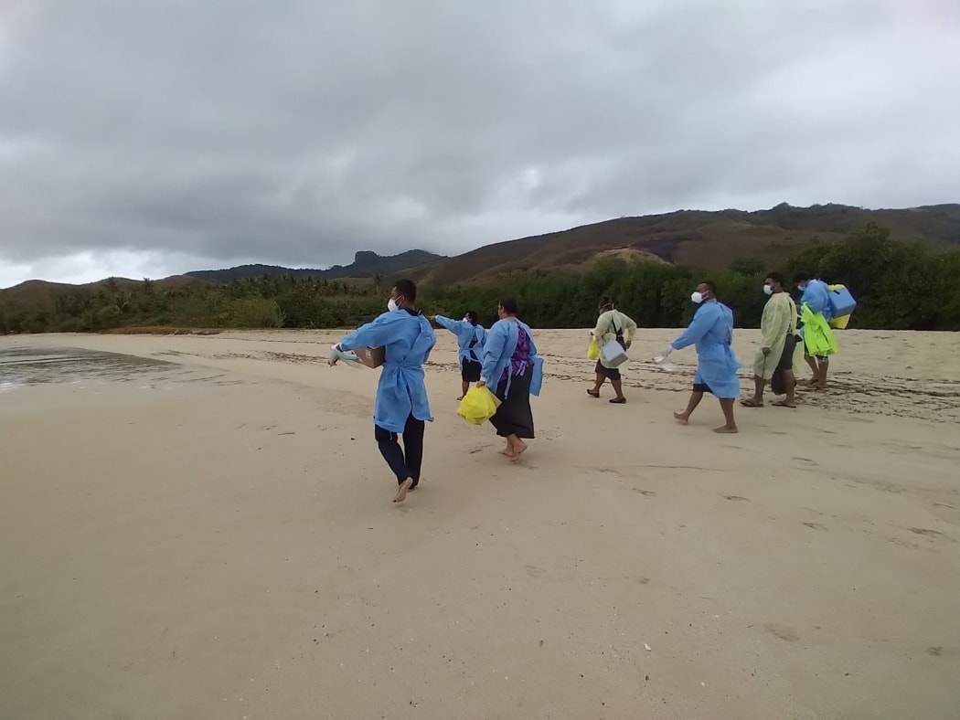 Front-line workers on their way to swab villagers in remote Fiji.