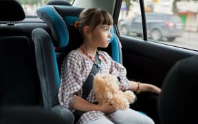 Children should not be left alone in parked cars and should be in an approved child restraint.