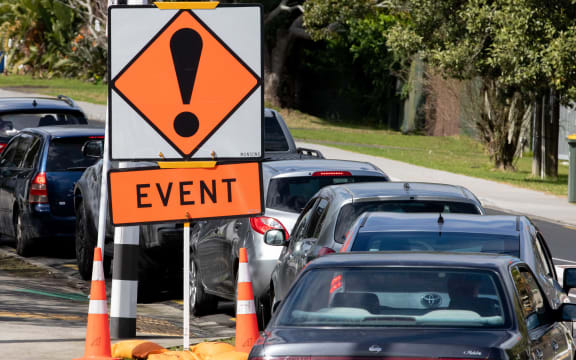 Cars queue outside Northcote testing station.