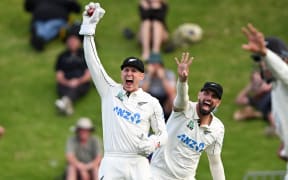 New Zealand wicketkeeper MItch Hay, left, and slip fielder Daryl Mitchell appeal successfully for an LBW decision against Anderson Phillip of the West Indies during Day 2 of the 2nd cricket test match at the Basin Reserve in Wellington, New Zealand, 11 December 2025. © Photo: Andrew Cornaga / Photosport
