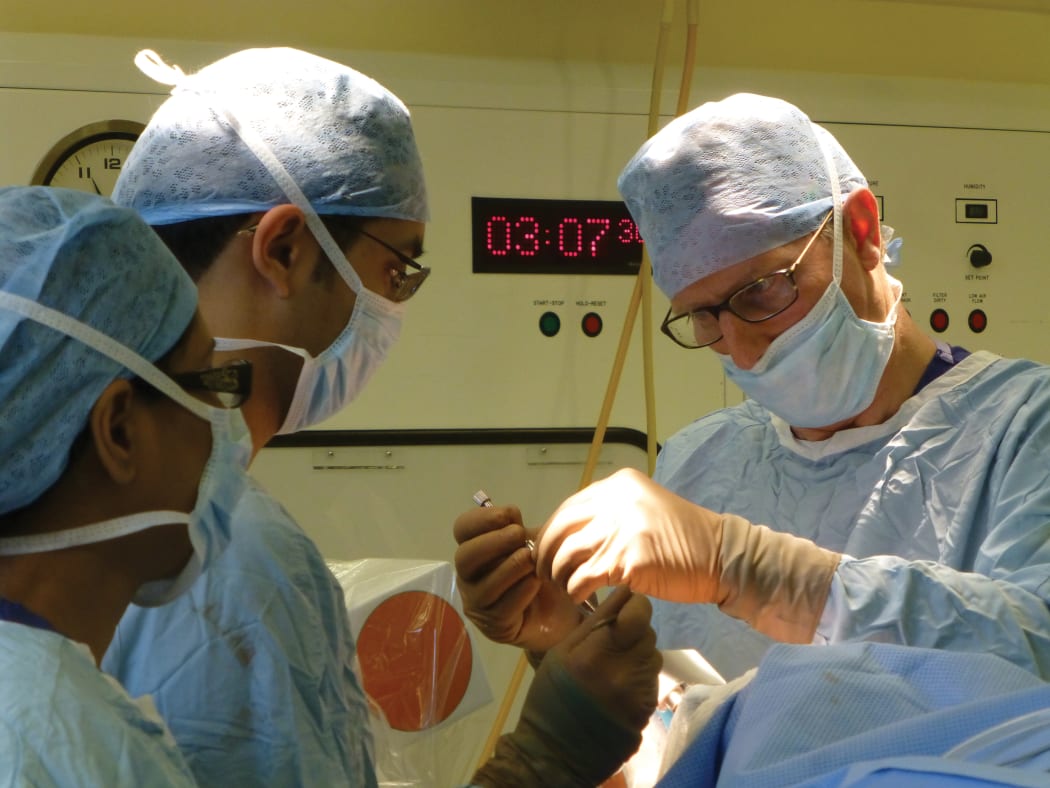 Professor Steven Gill and his team in theatre
