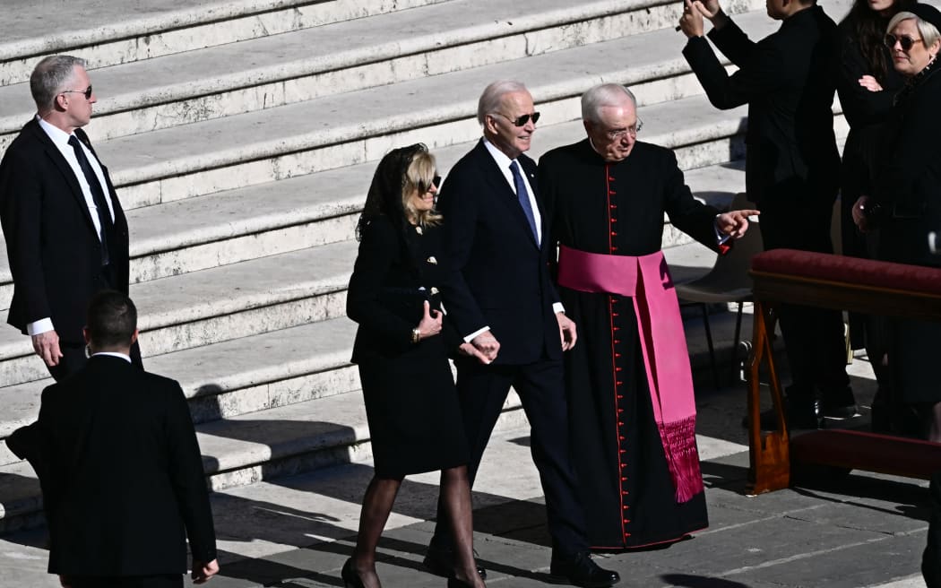 Former US President Joe Biden (C/R) and his wife Jill Biden (C/L) arrive ahead of the late Pope Francis' funeral ceremony at St Peter's Square at The Vatican on April 26, 2025. (Photo by Filippo MONTEFORTE / AFP)