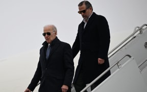 US President Joe Biden, with son Hunter Biden, arrives at Hancock Field Air National Guard Base in Syracuse, New York, on February 4, 2023. (Photo by ANDREW CABALLERO-REYNOLDS / AFP)