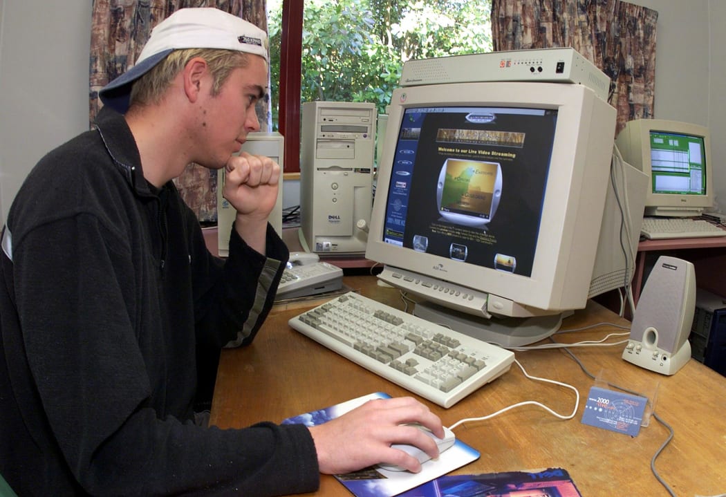 Computer technician Colin Jones puts the finishing touches to his "2000-Live" website in Gisborne 30 November 1999 which will broadcast on-line (www.2000-Live.com) the dawn of the new millennium via five remote-controlled video cameras.