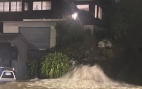 A stormwater drain gushing water on Forbury Road, St Clair.