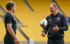 Beauden Barrett (L) and John Plumtree (R).