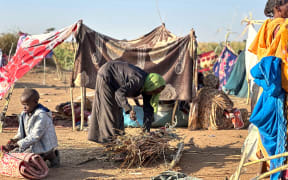 Displaced Sudanese who fled El-Fasher after the city fell to the Rapid Support Forces (RSF), set up camp in the town of Tawila in war-torn Sudan's western Darfur region on October 28, 2025. Fears mounted in Sudan on October 28, three days after paramilitaries seized the key city of El-Fasher, amid reports of mass atrocities and the killing of five Red Crescent volunteers in Kordofan. The capture of El-Fasher, the historic heart of Darfur, has sparked fears of mass killings reminiscent of the region’s darkest days. (Photo by AFP)