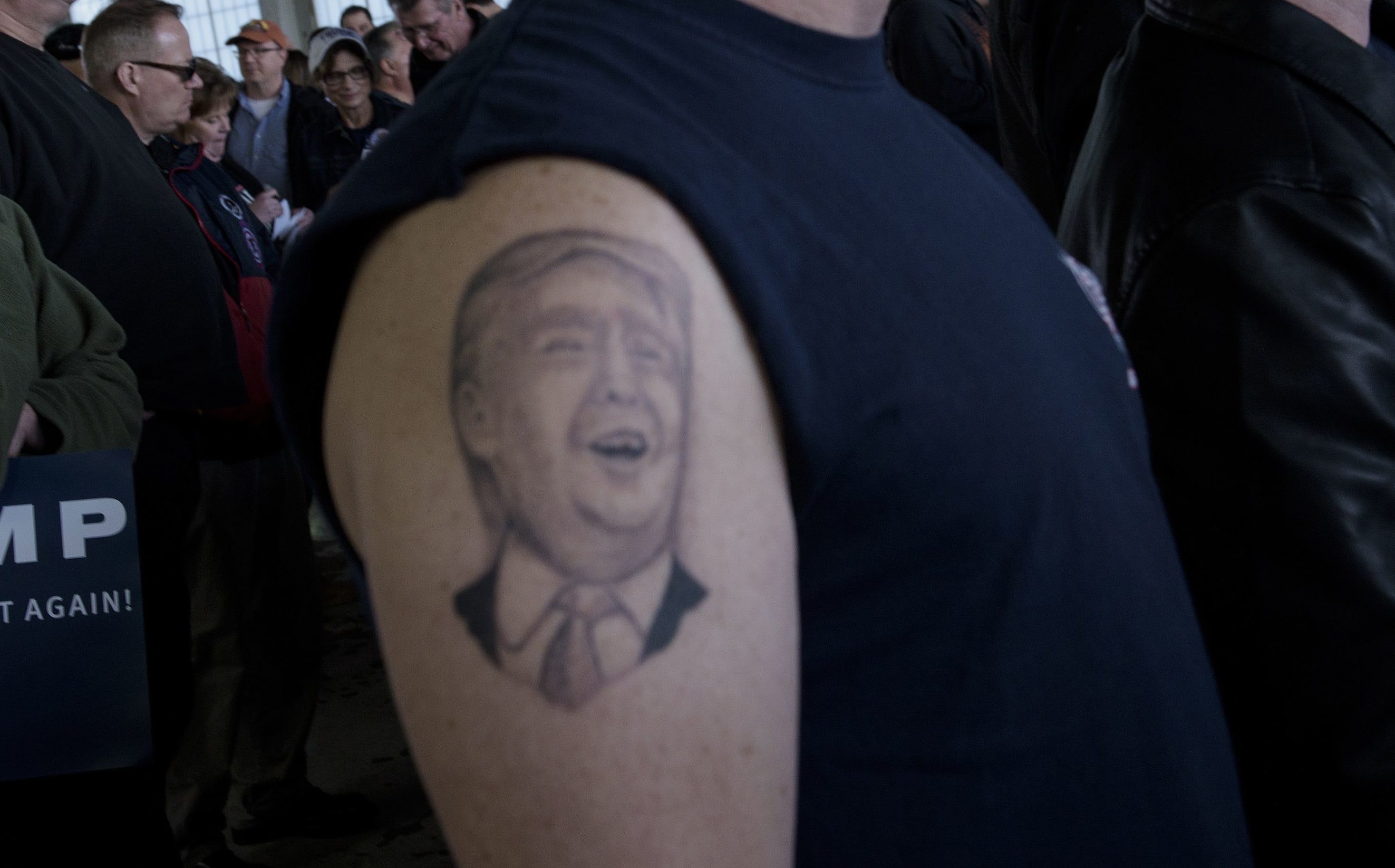 A tattoo of US Republican presidential hopeful Donald Trump on a supporter's arm.