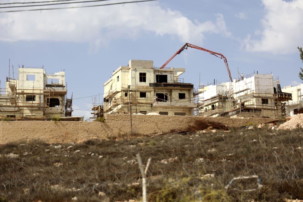 This file photo taken on October 13, 2021, shows construction in the Israeli settlement of Rahalim, located near the village of Yatma, south of Nablus in the occupied West Bank.