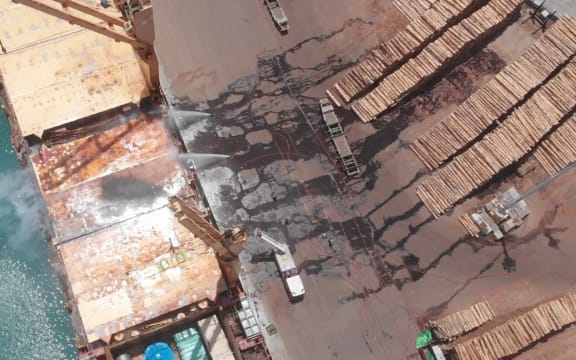 Firefighters battle a blaze on a container ship at Napier Port, on 18 December, 2020.