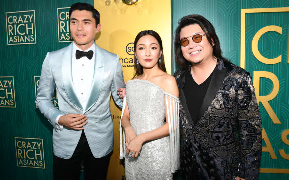 Actor Henry Golding, actress Constance Wu, and Kevin Kwan arrive at Warner Bros. Pictures' 'Crazy Rich Asians' Premiere at Warner Bros.