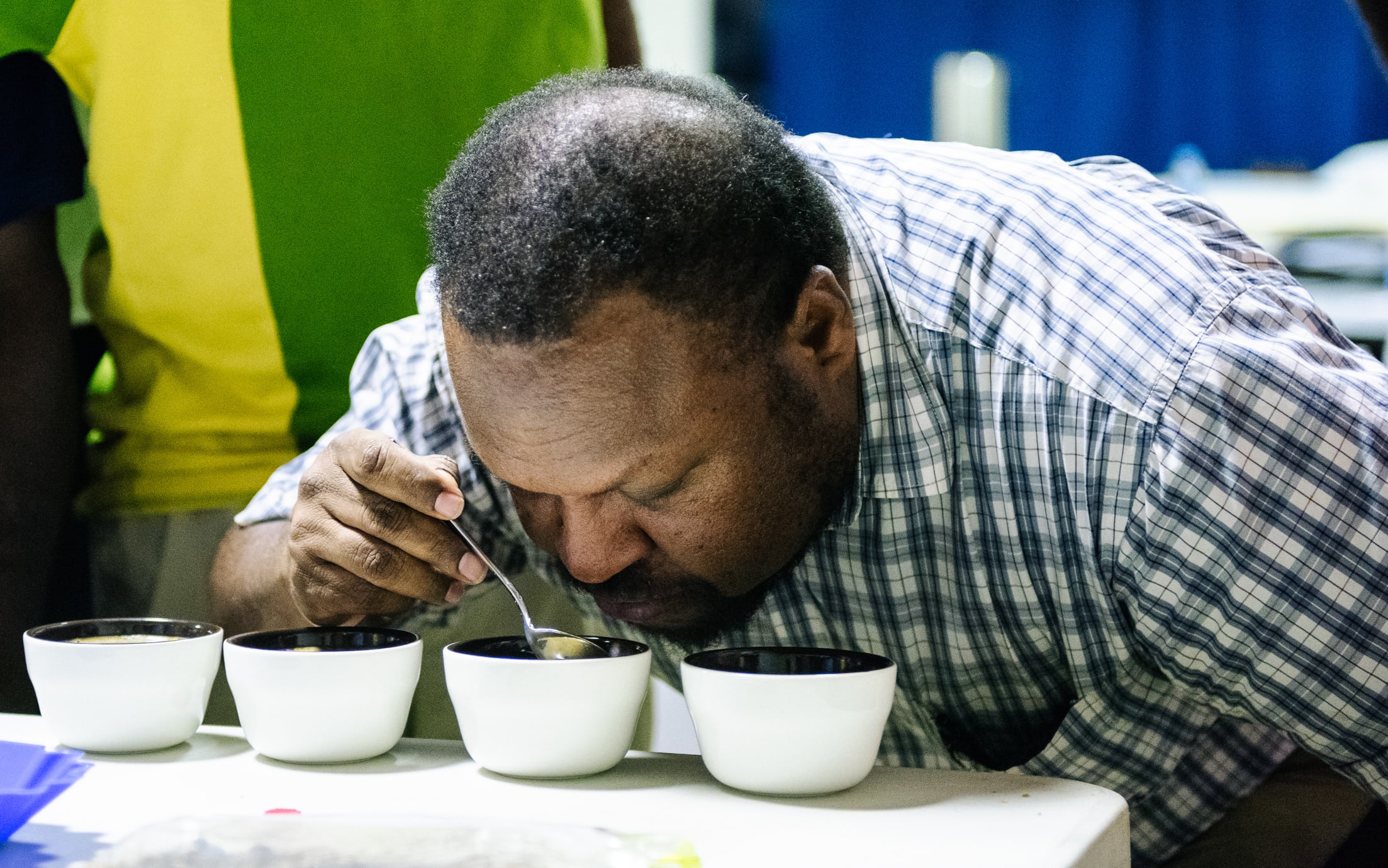 HOAC Chairman Daniel Kinne cupping his coffee in PNG.