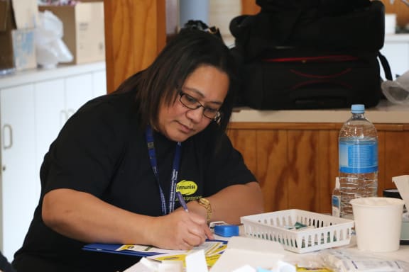 Community nurse Sita Moala working at the measles vaccination drop in centre at the Free Church of Tonga in Mangere today.