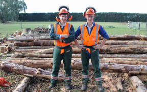 Year 12 students James Arnold and Mathew Reed learn how to use a chainsaw.