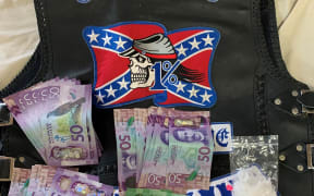 Cash and drugs seized during a police operation against the Rebels MC gang.