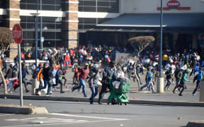 People protest against the imprisonment of former president Jacob Zuma, in Johannesburg, South Africa on 12 July, 2021.