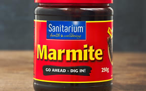AUCKLAND, NEW ZEALAND - APRIL 02, 2016: A jar of Marmite, popular yeast extract product in New Zealand made by Sanitarium.