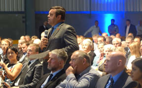 Shareholders ask questions of the board.