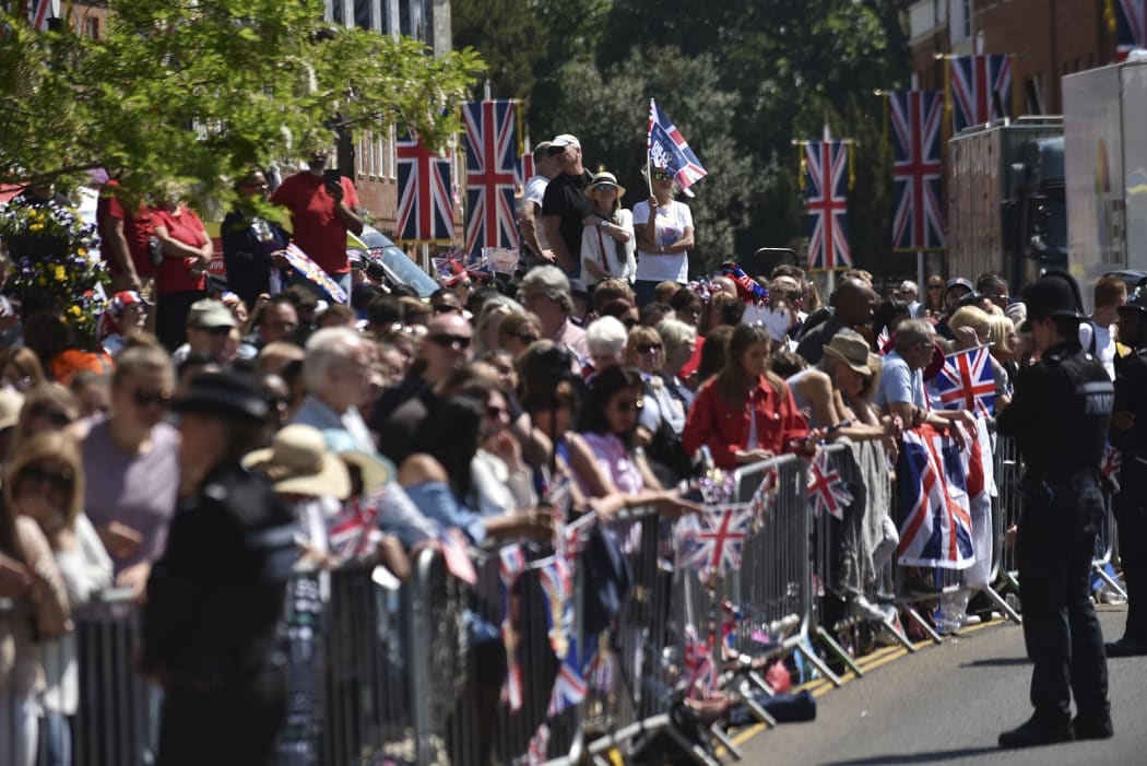 Fans gather in Windsor Castle to celebrate the wedding between Prince Harry of Wales and Ms Meghan Markle.