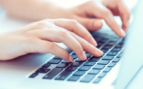 Female hands or woman office worker typing on the keyboard