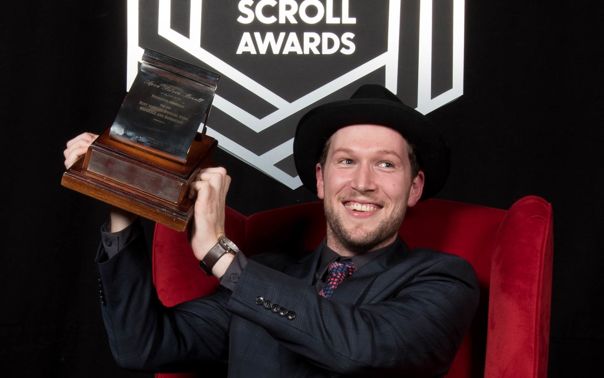 Thomas Oliver with his award, the 2016 Apra Silver Scroll
