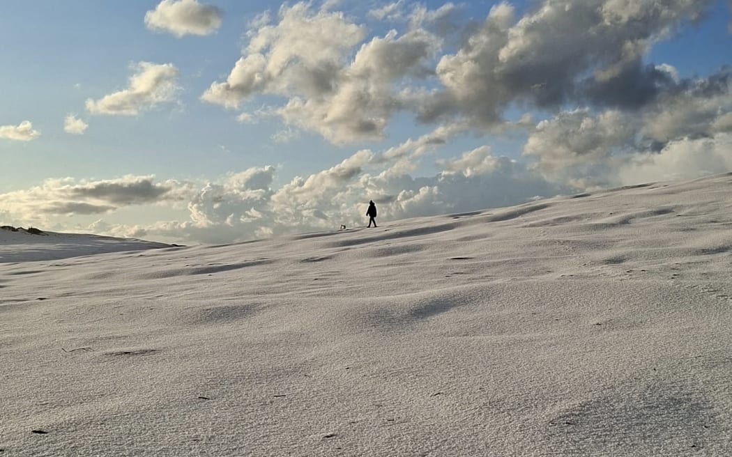 The beach at Pouto, south of Dargaville, is blanketed in ice after a freak hail storm.