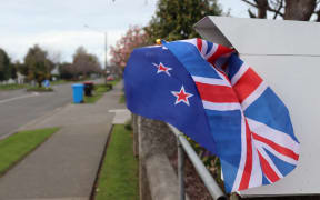 Dorothy Galloway put the UK and NZ flags by her letterbox to remember the Queen.