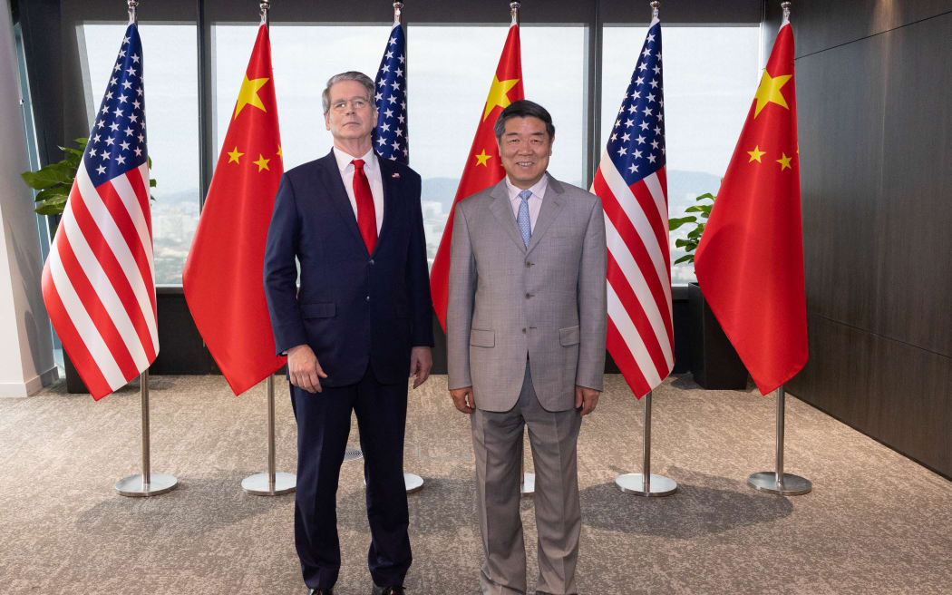 Chinese Vice Premier He Lifeng poses for a photo with US Treasury Secretary Scott Bessent prior to their talks in Kuala Lumpur, Malaysia, on 25 October, 2025.