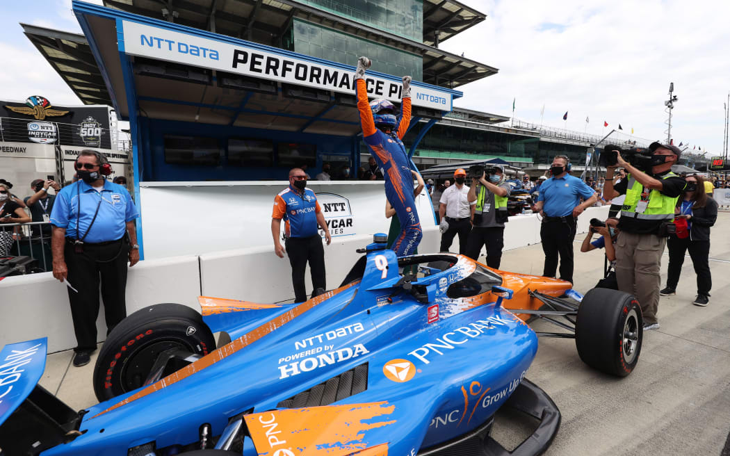 Scott Dixon reacts to winning the pole for the 105th running of the Indianapolis 500 on May 23, 2021 at the Indianapolis Motor Speedway in Indianapolis, Indiana.